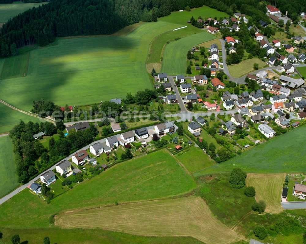 Geroldsgrün from above - Agricultural land and field boundaries with the power plants surround the settlement area of the village in Geroldsgrün in the state Bavaria, Germany