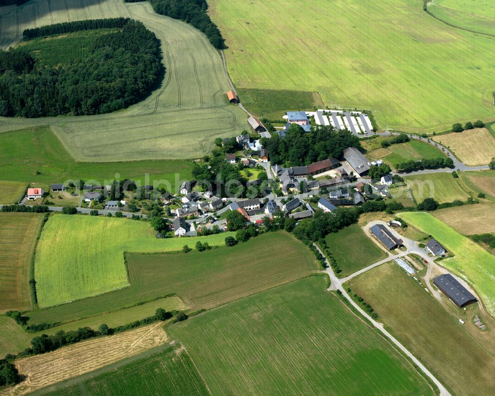 Aerial image Gumpertsreuth - Agricultural land and field boundaries with the power plants surround the settlement area of the village in Gumpertsreuth in the state Bavaria, Germany