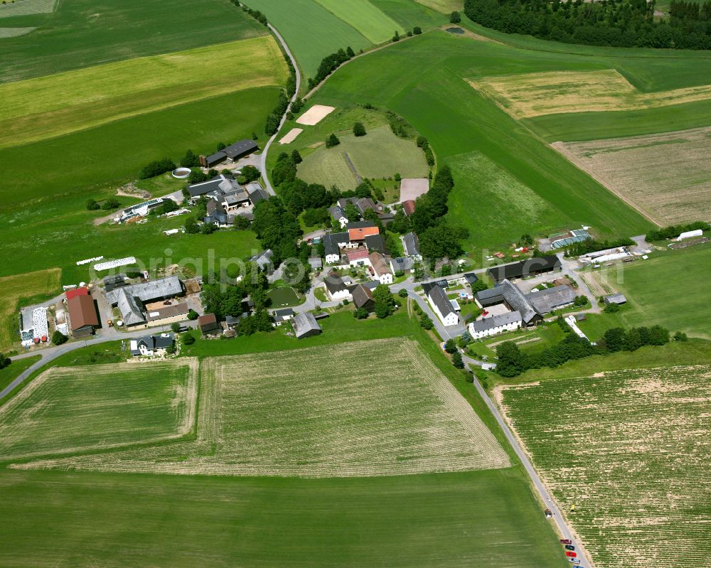 Aerial photograph Kühschwitz - Agricultural land and field boundaries with the power plants surround the settlement area of the village in Kühschwitz in the state Bavaria, Germany