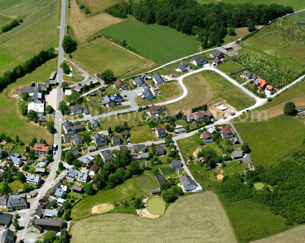 Aerial photograph Langenbach - Agricultural land and field boundaries with the power plants surround the settlement area of the village in Langenbach in the state Bavaria, Germany