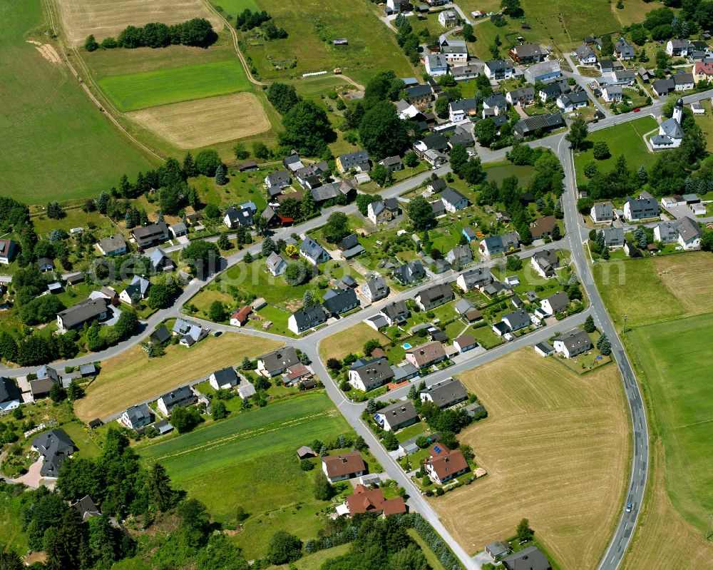 Langenbach from the bird's eye view: Agricultural land and field boundaries with the power plants surround the settlement area of the village in Langenbach in the state Bavaria, Germany