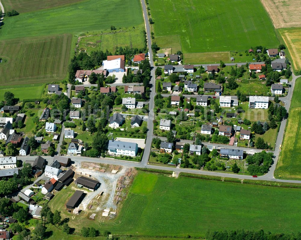 Martinlamitz from above - Agricultural land and field boundaries with the power plants surround the settlement area of the village in Martinlamitz in the state Bavaria, Germany