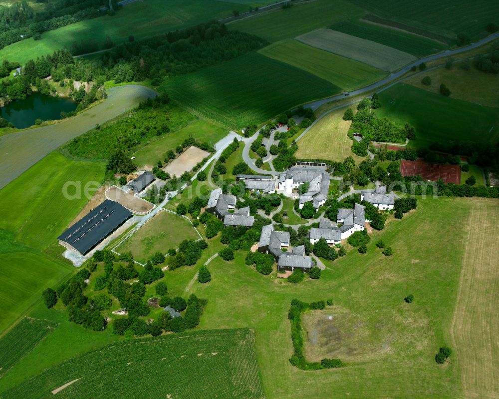 Aerial image Naila - Agricultural land and field boundaries with the power plants surround the settlement area of the village in Naila in the state Bavaria, Germany