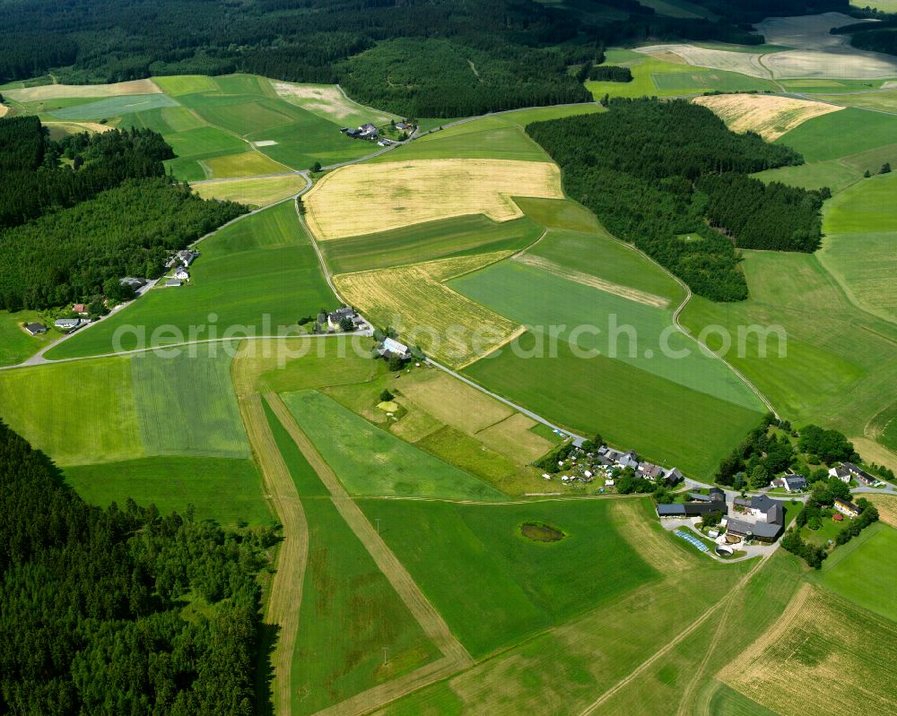 Oberhartmannsreuth from above - Agricultural land and field boundaries with the power plants surround the settlement area of the village in Oberhartmannsreuth in the state Bavaria, Germany