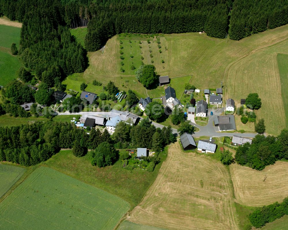 Aerial image Schönbrunn - Agricultural land and field boundaries with the power plants surround the settlement area of the village in Schönbrunn in the state Bavaria, Germany