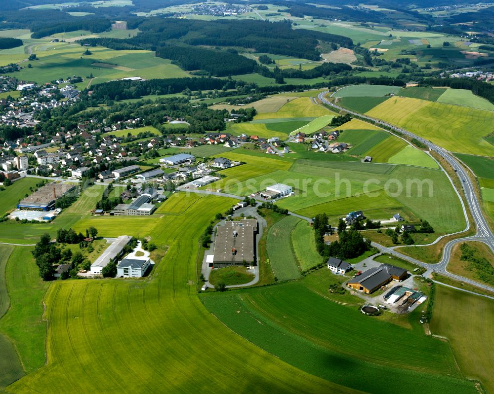 Aerial photograph Selbitz - Agricultural land and field boundaries with the power plants surround the settlement area of the village in Selbitz in the state Bavaria, Germany