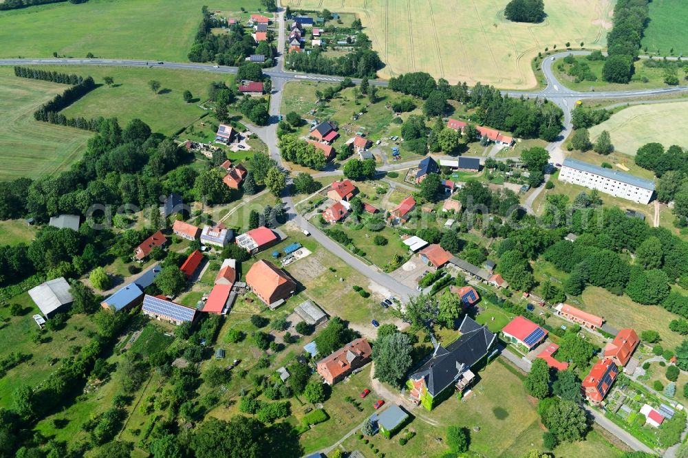 Retzin from the bird's eye view: Agricultural land and field borders surround the settlement area of the village in Retzin in the state Brandenburg, Germany