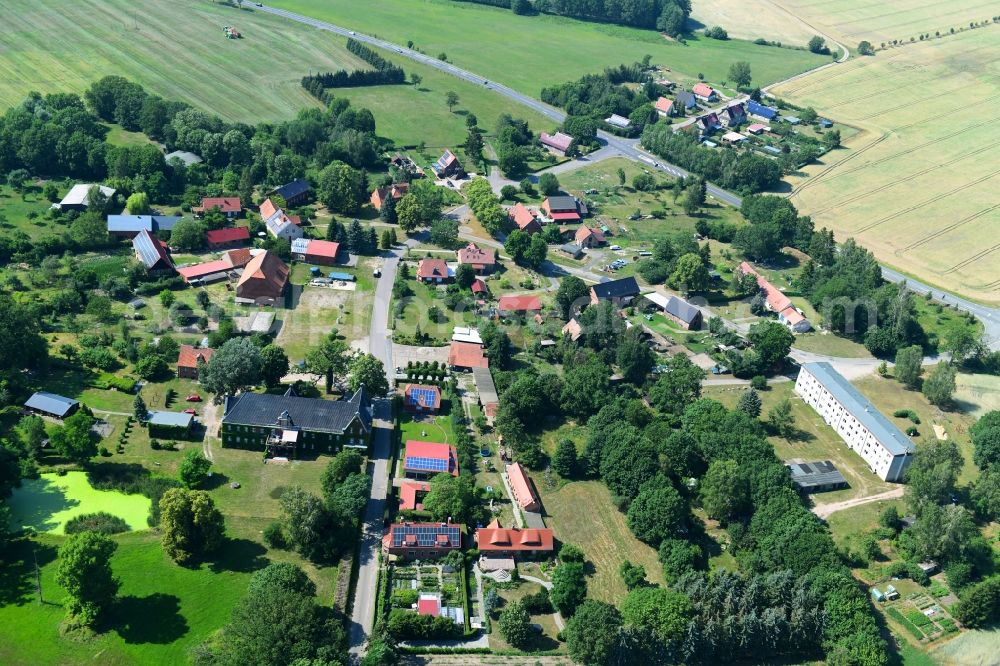 Aerial image Retzin - Agricultural land and field borders surround the settlement area of the village in Retzin in the state Brandenburg, Germany