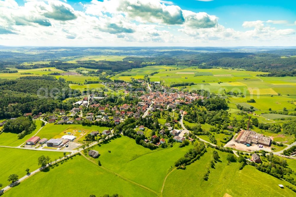 Aerial image Sachsenberg - Agricultural land and field borders surround the settlement area of the village in Sachsenberg in the state Hesse, Germany