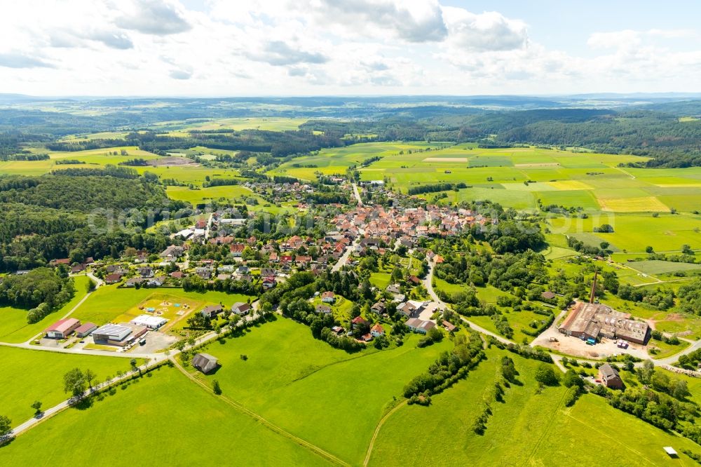 Aerial photograph Sachsenberg - Agricultural land and field borders surround the settlement area of the village in Sachsenberg in the state Hesse, Germany