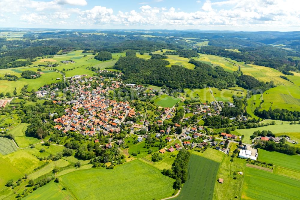 Aerial photograph Sachsenberg - Agricultural land and field borders surround the settlement area of the village in Sachsenberg in the state Hesse, Germany