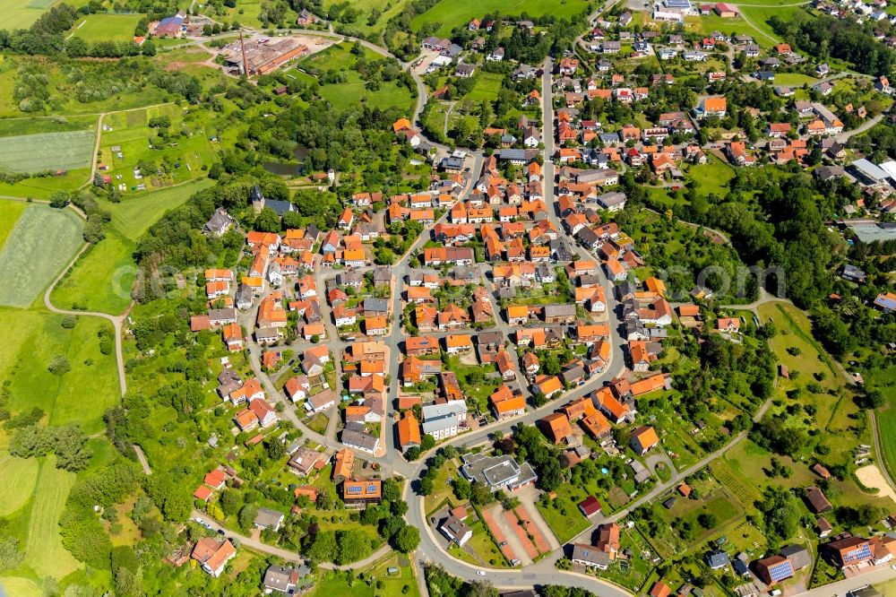 Aerial photograph Sachsenberg - Agricultural land and field borders surround the settlement area of the village in Sachsenberg in the state Hesse, Germany