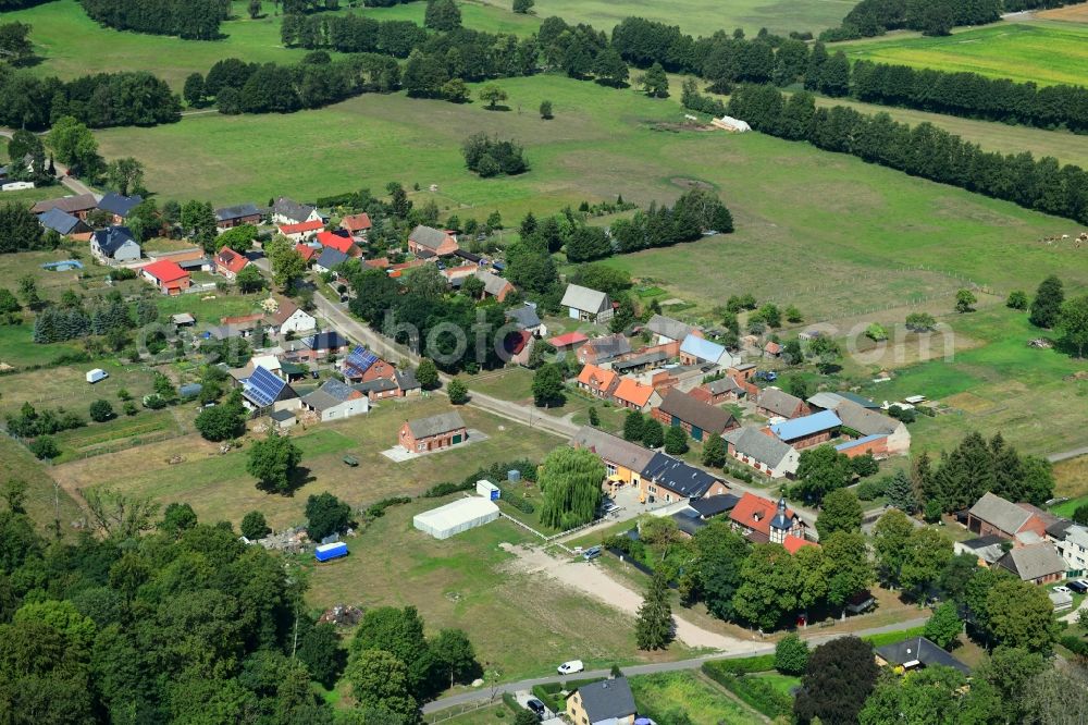 Aerial image Schilde - Agricultural land and field borders surround the settlement area of the village in Schilde in the state Brandenburg, Germany