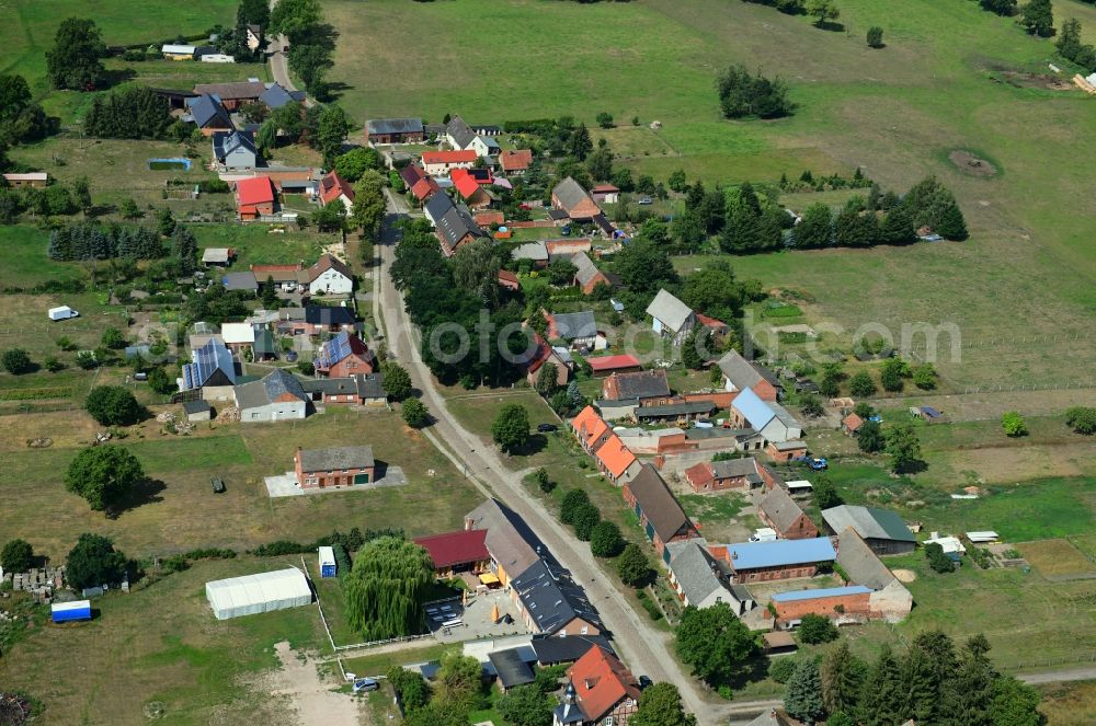 Aerial photograph Schilde - Agricultural land and field borders surround the settlement area of the village in Schilde in the state Brandenburg, Germany