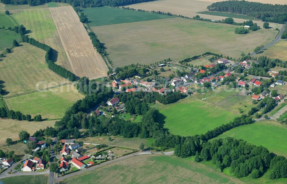 Aerial image Schopsdorf - Agricultural land and field borders surround the settlement area of the village in Schopsdorf in the state Saxony-Anhalt, Germany