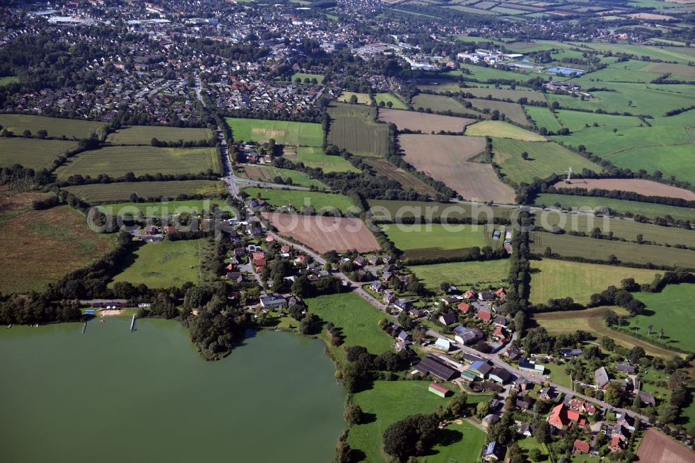 Aerial photograph Borgdorf - Village on the lake bank areas of Borgdorfer Lake in Borgdorf in the state Schleswig-Holstein