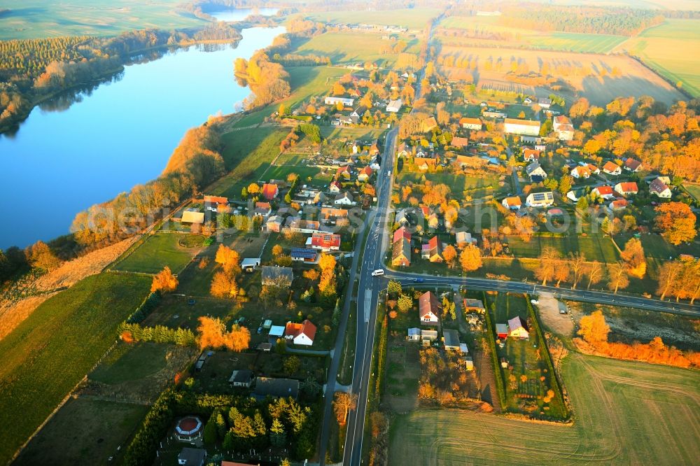 Aerial image Möllenbeck - Village on the lake bank areas of Moellenbecker Haussee in Moellenbeck in the state Mecklenburg - Western Pomerania, Germany