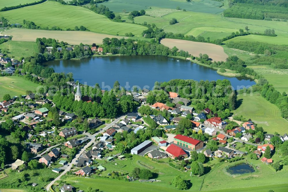 Neukirchen from above - Village on the lake bank areas at the Neukirchener lake in Neukirchen in the state Schleswig-Holstein, Germany