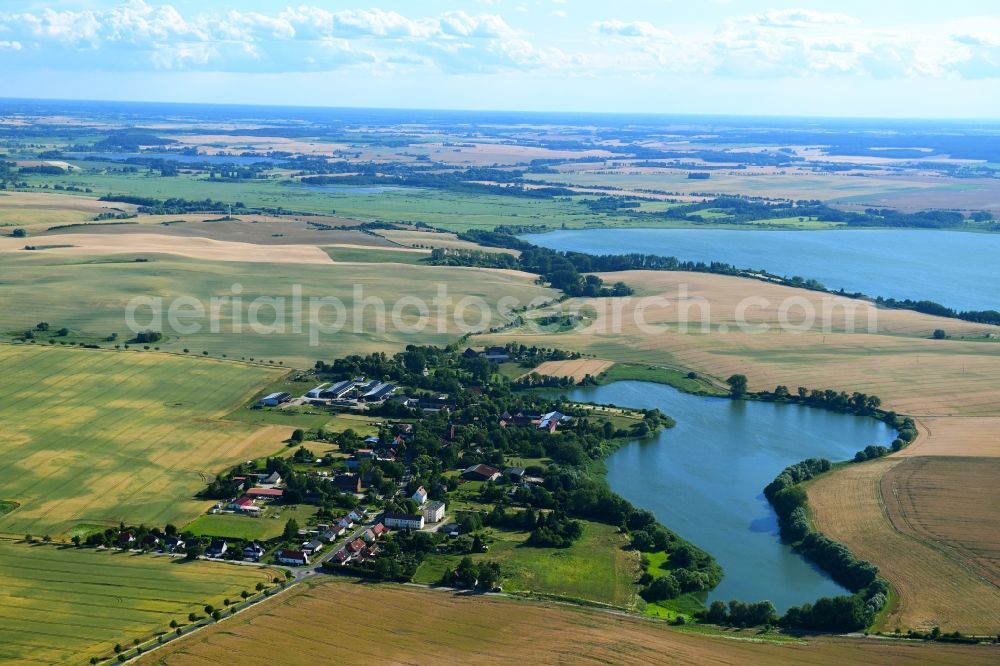 Seelübbe from above - Village on the lake bank areas of Seeluebber See in Seeluebbe in the state Brandenburg, Germany