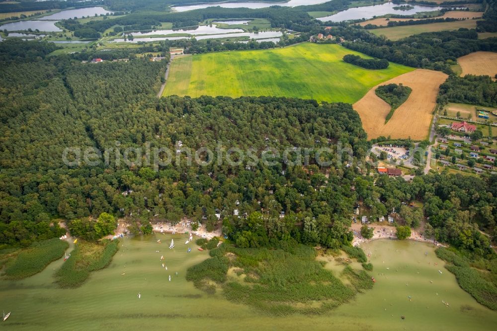 Aerial image Boeker Mühle - Village on the lake bank areas of lake Mueritz with forest- and grassland in Boeker Muehle in the state Mecklenburg - Western Pomerania