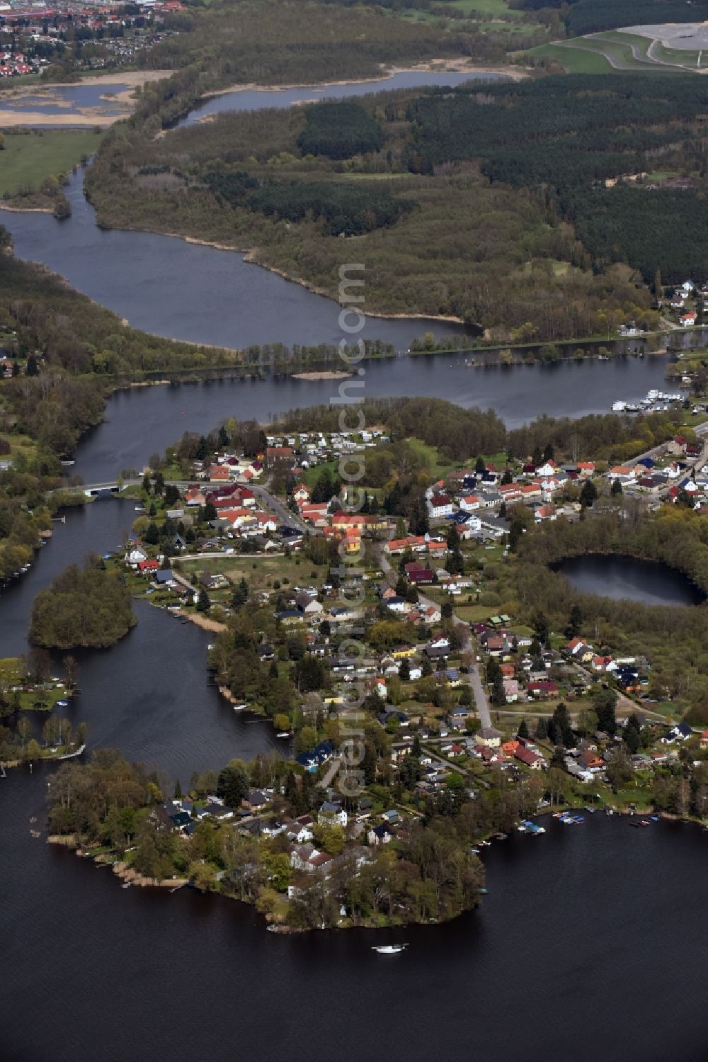 Wernsdorf from the bird's eye view: Village on the lake bank areas in Wernsdorf in the state Brandenburg