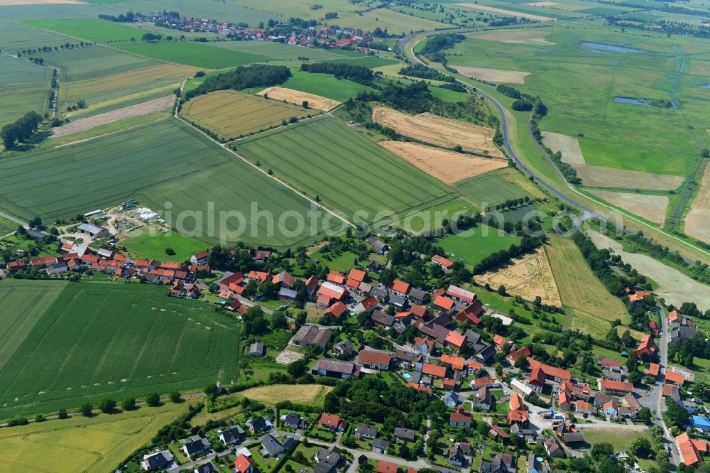 Aerial image Sülbeck - Agricultural land and field borders surround the settlement area of the village in Suelbeck in the state Lower Saxony, Germany