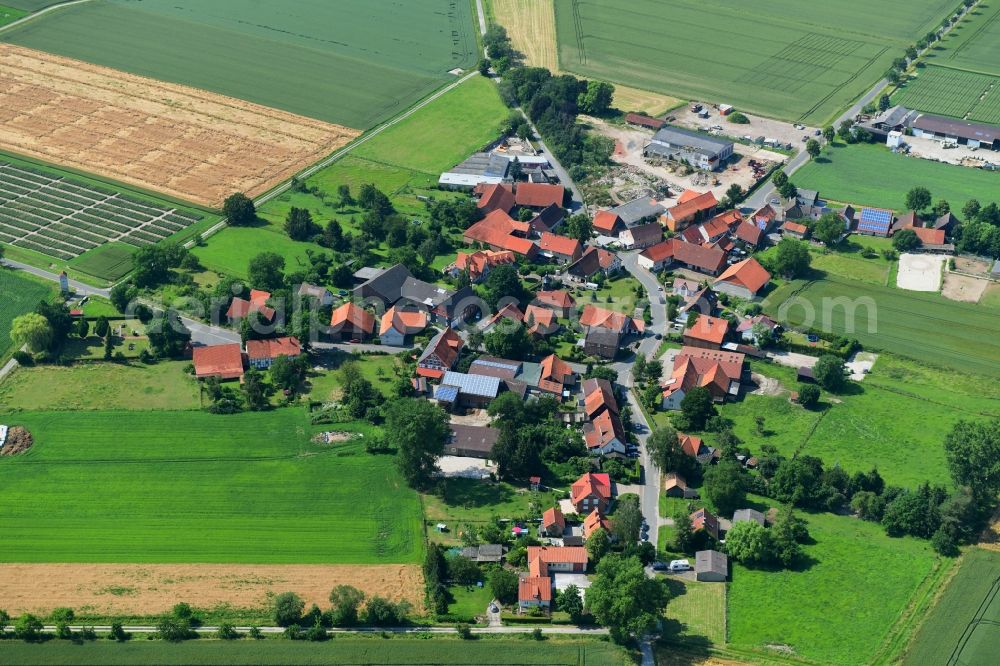 Strodthagen from above - Agricultural land and field borders surround the settlement area of the village in Strodthagen in the state Lower Saxony, Germany