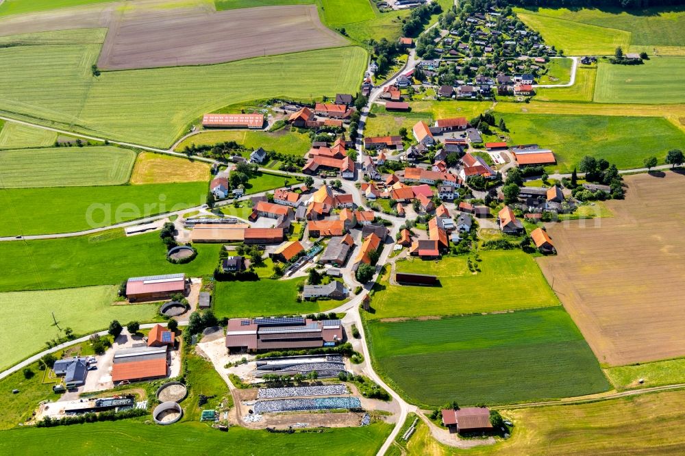 Aerial photograph Sudeck - Agricultural land and field borders surround the settlement area of the village in Sudeck in the state Hesse, Germany