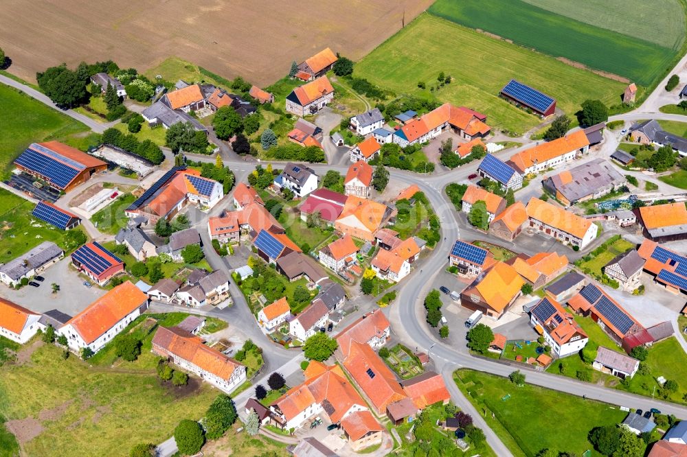 Aerial photograph Sudeck - Agricultural land and field borders surround the settlement area of the village in Sudeck in the state Hesse, Germany