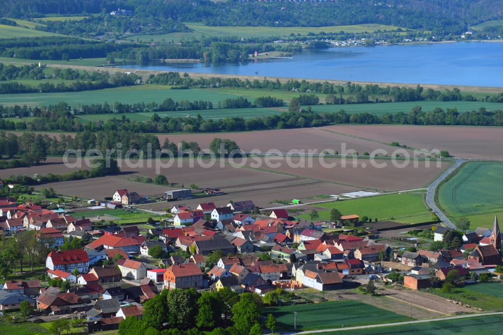 Thürungen from above - Agricultural land and field borders surround the settlement area of the village in Thuerungen in the state Saxony-Anhalt, Germany