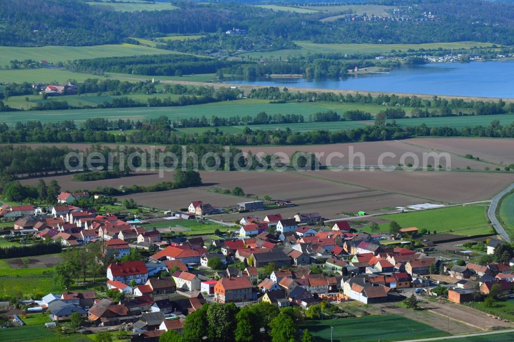 Thürungen from the bird's eye view: Agricultural land and field borders surround the settlement area of the village in Thuerungen in the state Saxony-Anhalt, Germany