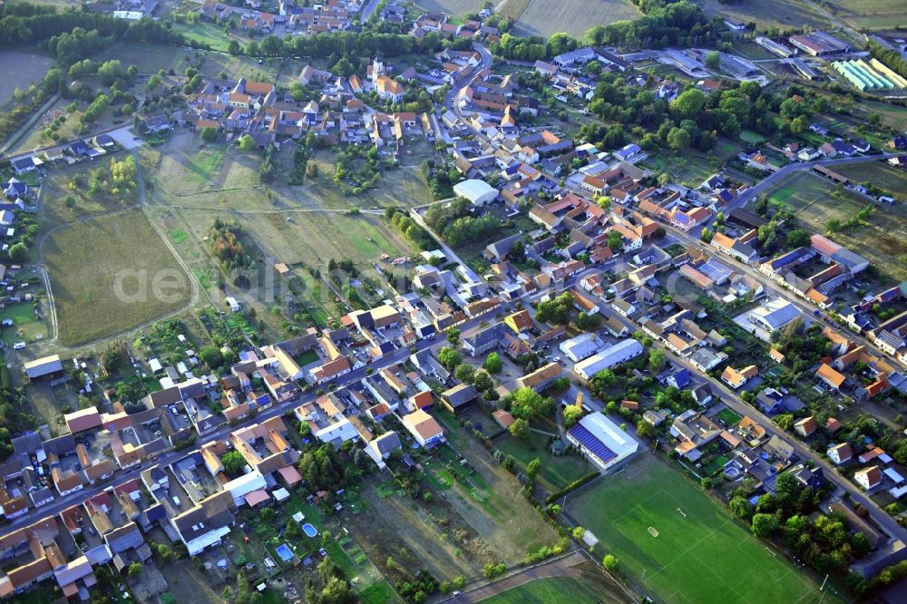 Aerial photograph Tucheim - Agricultural land and field borders surround the settlement area of the village in Tucheim in the state Saxony-Anhalt, Germany