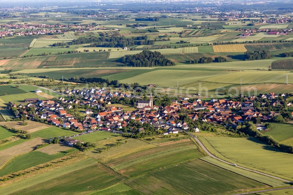 Aerial photograph Uhlwiller - Agricultural land and field borders surround the settlement area of the village in Uhlwiller in Grand Est, France