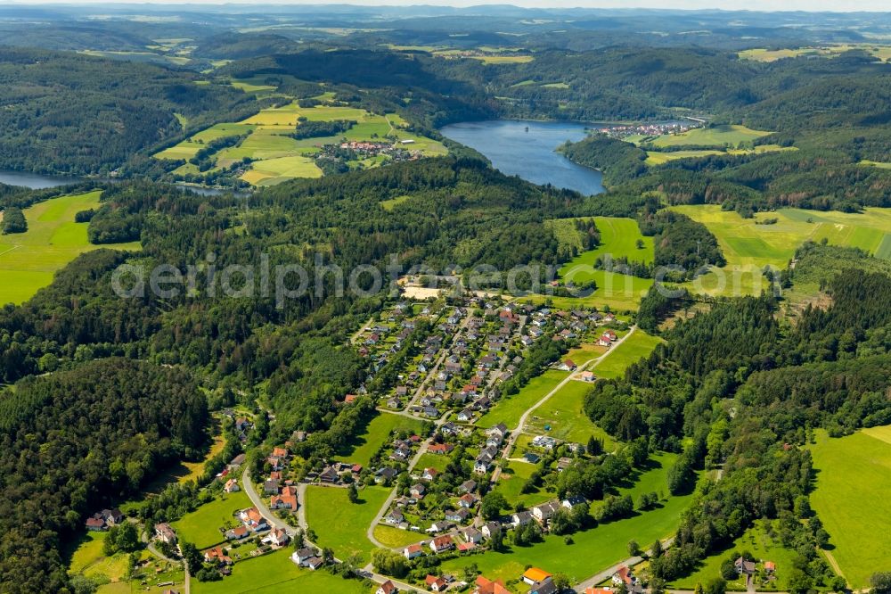 Aerial photograph Vöhl - Agricultural land and field borders surround the settlement area of the village in Voehl in the state Hesse, Germany