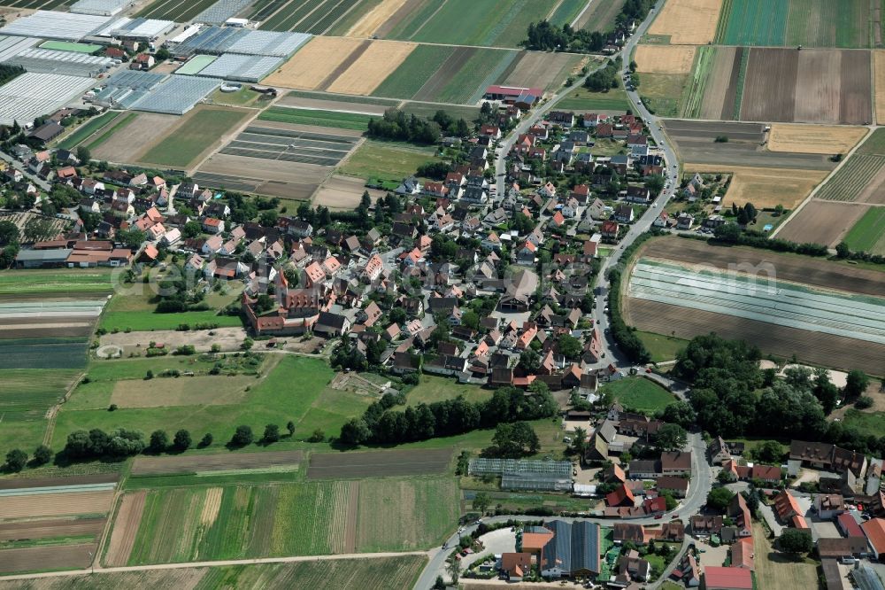 Aerial photograph Nürnberg - Village center in Nuremberg Kraftshof in Bavaria. Left of center is the Church of St. George with a fortified cemetery. The medieval church (former St. Mary and Holy Cross) is surrounded entirely by a defensive wall with battlements and corner towers