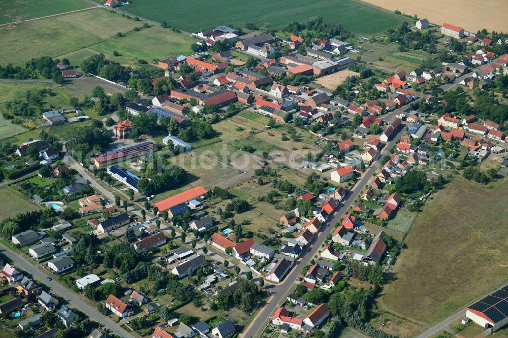 Aerial photograph Wörmlitz - Agricultural land and field borders surround the settlement area of the village in Woermlitz in the state Saxony-Anhalt, Germany