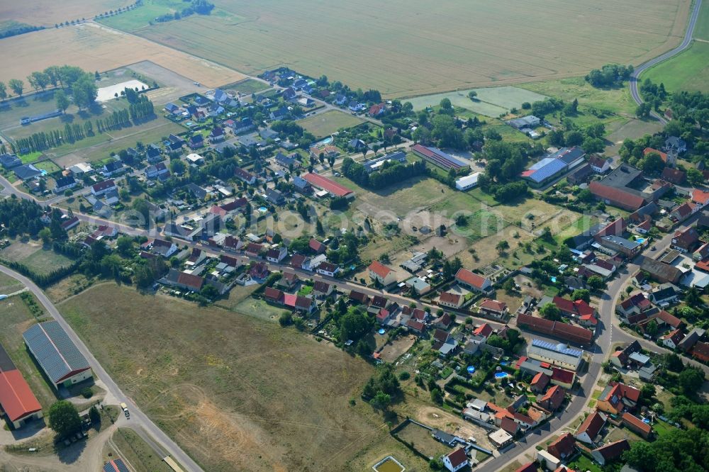 Aerial photograph Wörmlitz - Agricultural land and field borders surround the settlement area of the village in Woermlitz in the state Saxony-Anhalt, Germany