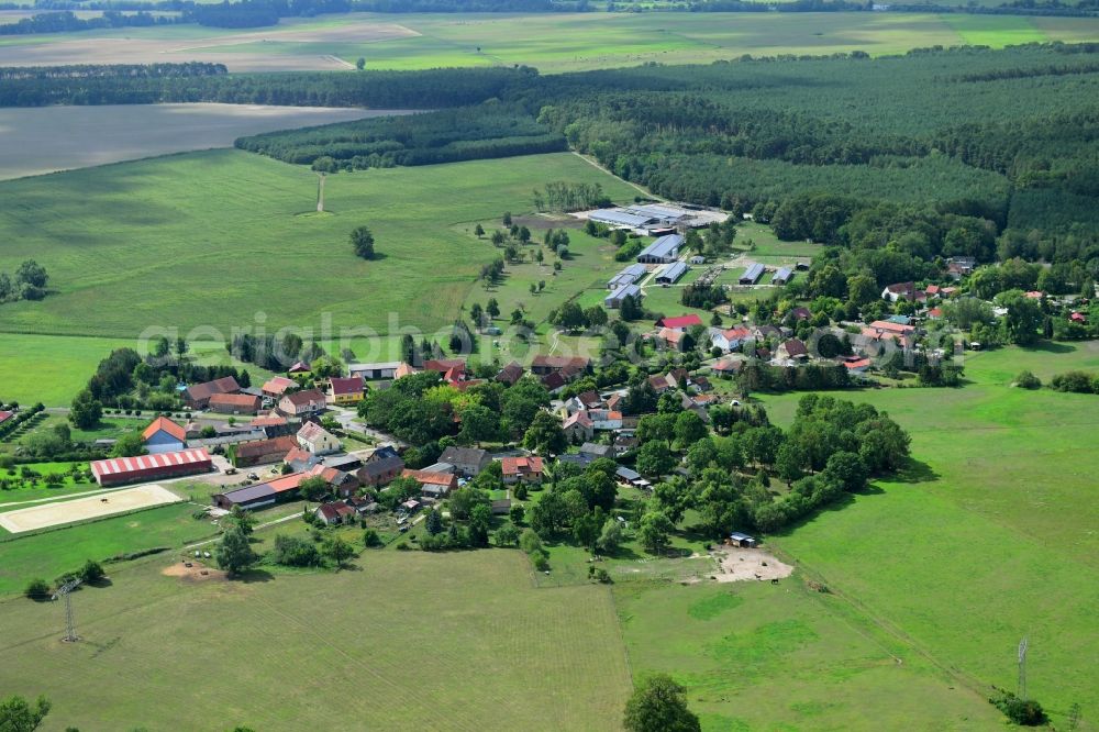 Aerial image Wutzetz - Agricultural land and field borders surround the settlement area of the village in Wutzetz in the state Brandenburg, Germany