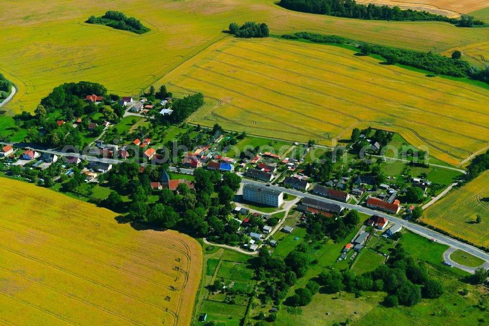 Aerial image Zettemin - Agricultural land and field borders surround the settlement area of the village in Zettemin in the state Mecklenburg - Western Pomerania, Germany