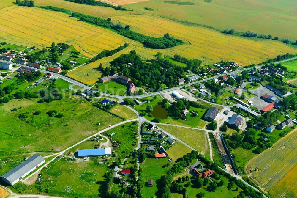 Zettemin from above - Agricultural land and field borders surround the settlement area of the village in Zettemin in the state Mecklenburg - Western Pomerania, Germany