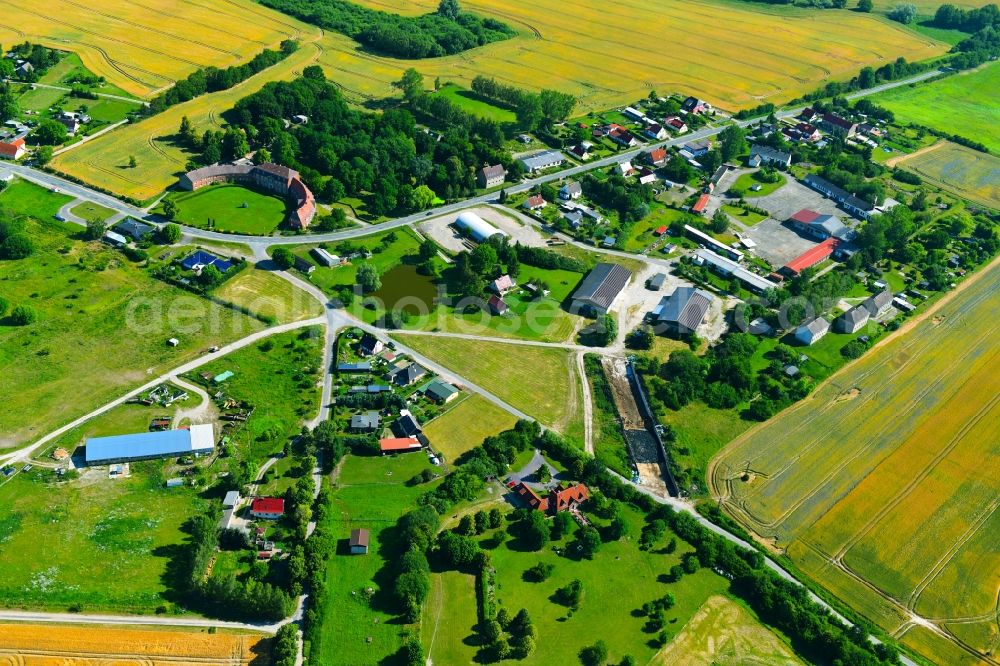 Zettemin from the bird's eye view: Agricultural land and field borders surround the settlement area of the village in Zettemin in the state Mecklenburg - Western Pomerania, Germany