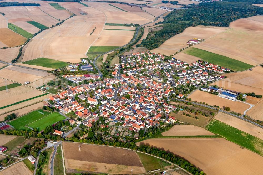 Zeuzleben from the bird's eye view: Agricultural land and field borders surround the settlement area of the village in Zeuzleben in the state Bavaria, Germany