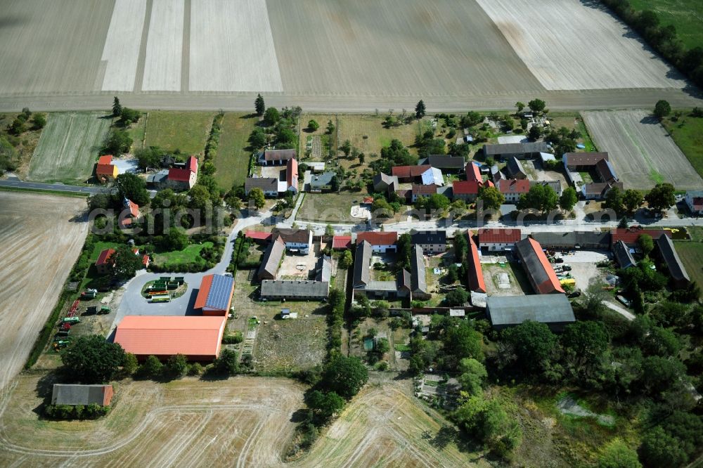 Aerial image Zixdorf - Agricultural land and field borders surround the settlement area of the village in Zixdorf in the state Brandenburg, Germany