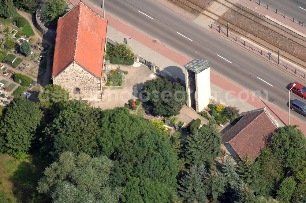 Aerial image Halle (Saale) - Strasse der Romanik: Diese romanische Saalkirche mit Apsis steht in Böllberg, als Beispiel der herben und schlichten Dorfkirchen jener Zeit. Der Bruchsteinbau ist ungewöhnlich gut erhalten, die Nordseite besitzt noch ihre ursprüngliche Gestalt mit den kleinen hoch liegenden Fenstern.