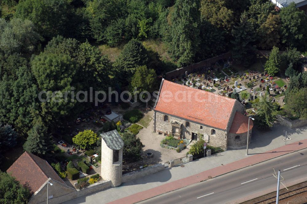 Aerial image Halle (Saale) - Strasse der Romanik: Diese romanische Saalkirche mit Apsis steht in Böllberg, als Beispiel der herben und schlichten Dorfkirchen jener Zeit. Der Bruchsteinbau ist ungewöhnlich gut erhalten, die Nordseite besitzt noch ihre ursprüngliche Gestalt mit den kleinen hoch liegenden Fenstern.