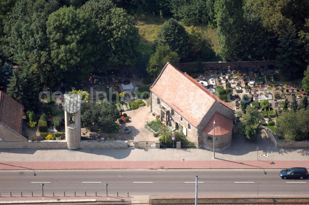 Aerial photograph Halle (Saale) - Strasse der Romanik: Diese romanische Saalkirche mit Apsis steht in Böllberg, als Beispiel der herben und schlichten Dorfkirchen jener Zeit. Der Bruchsteinbau ist ungewöhnlich gut erhalten, die Nordseite besitzt noch ihre ursprüngliche Gestalt mit den kleinen hoch liegenden Fenstern.