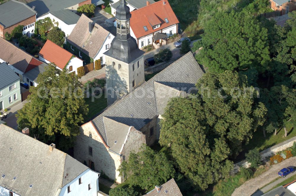 Leitzkau from the bird's eye view: Strasse der Romanik: In das Jahr 1107 gehen die Ursprünge der Kirche St. Petri zurück. Vom Brandenburger Bischof Harbert wurde sie als hölzerne Kapelle gegründet und 1114 durch einen Steinbau ersetzt. Dieser interessante romanische Bau gehört zu den ersten sakralen Steinbauten dieser Gegend. Leitzkau 2007/08/07 Strasse der Romanik: The origins of St Petri church date back to 1107. It was founded as a wooden chapel by bishop Harbert of Brandenburg, and replaced in 1114 by a stone structure. This interesting Romanesque building is one of the first religious buildings in the region.