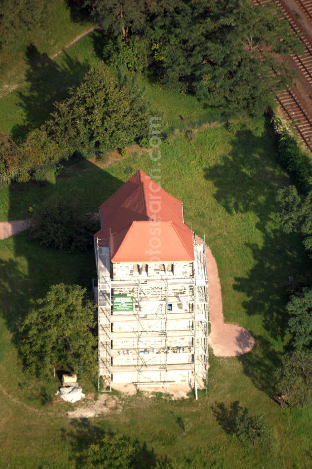 Bernburg from the bird's eye view: Strasse der Romanik: Blick auf die Dorfkirche St.Stephani. Gebaut etwa um 1180 steht der flach gedeckte Feldsteinbau im ehemaligen Waldau, welches seit 1871 zu Bernburg gehört. Eine umfassende Restaurierung fand 1930 statt, im Andenken an den heiligen Stephanus wurde sichtbar ein Stein aus Jerusalem in der Kirche angebracht.