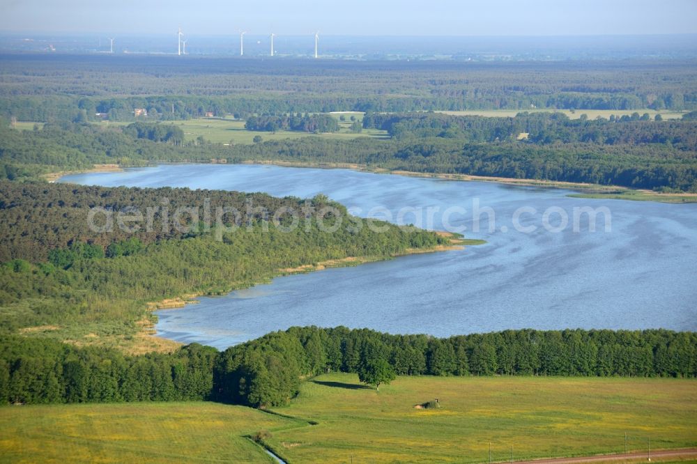 Löwenberger Land from the bird's eye view: Dreetzsee lake in the borough of Loewenberger Land in the state of Brandenburg. The lake is surrounded by trees and forest, the next village is the Grueneberg part of the borough