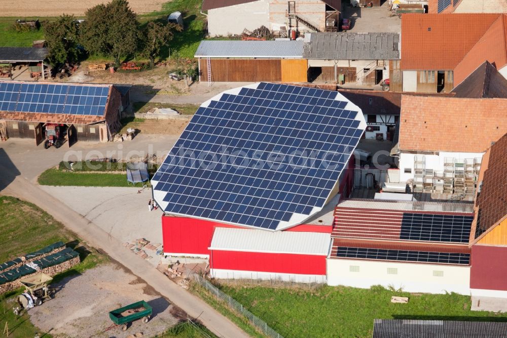 Kapellen-Drusweiler from the bird's eye view: Panel rows of photovoltaic turnable roof of a stable in the district Deutschhof in Kapellen-Drusweiler in the state Rhineland-Palatinate